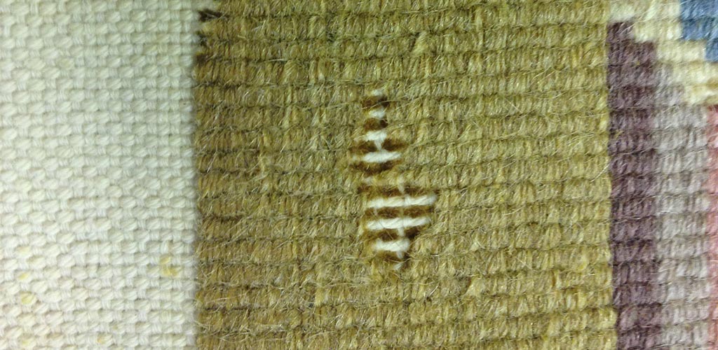 Moth Damage on back of Chinese Rug